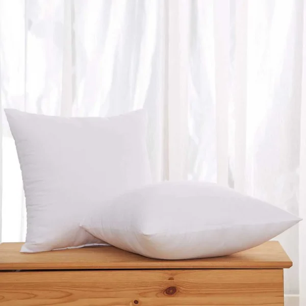 Two plump square cushion inserts stacked vertically, showing high-loft polyester ball fiber filling for decorative throw pillows