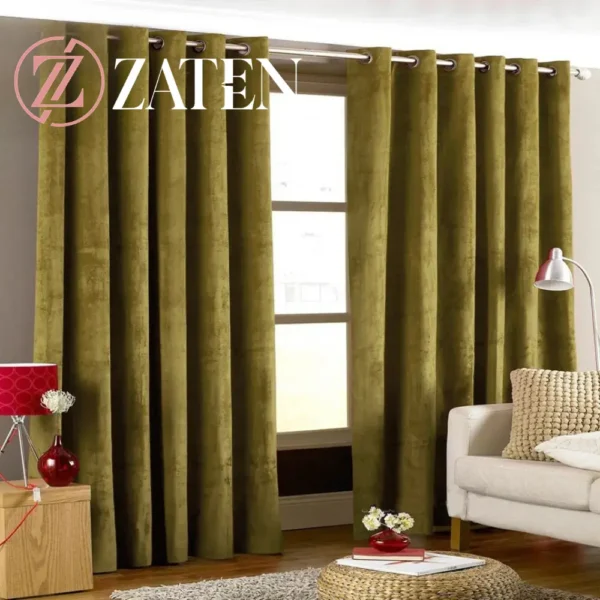 A pair of earthy olive green velvet curtains with a soft matte finish and silver stainless steel eyelets, ideal for a natural, organic home aesthetic.
