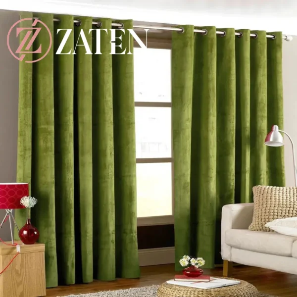 Two panels of premium deep green velvet curtains with silver eyelet rings, showing a rich, forest-inspired hue and plush texture