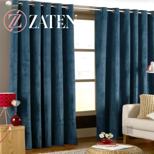 Two panels of vibrant royal blue velvet curtains with silver eyelets, featuring a rich jewel-toned fabric and plush finish.