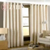 Luxury off-white plain dyed velvet curtains with eyelet rings, hanging in a pair to show soft texture and light-filtering quality